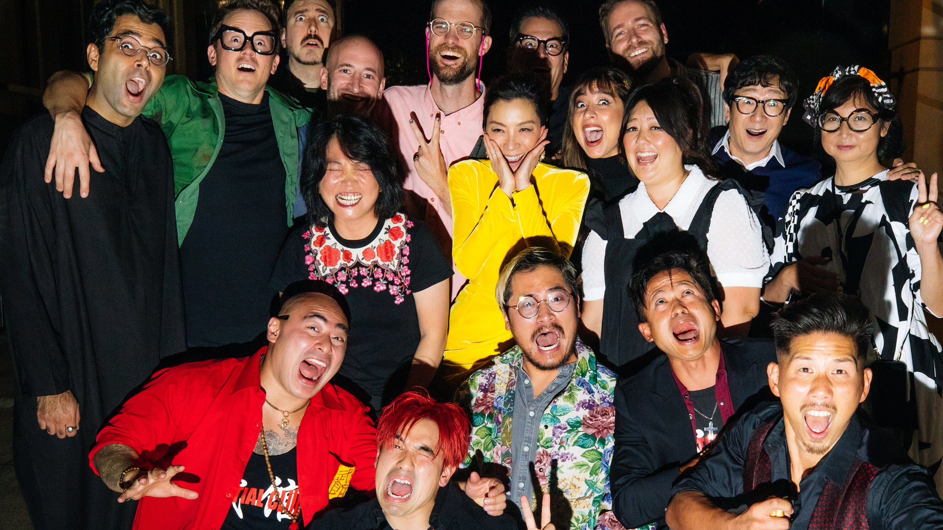 The cast and crew of 'Everything Everywhere All At Once' posing for a group picture.